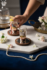 INVOKE copper banded clear glass shot glasses with wooden coasters and mirrored bases. Set of 2.