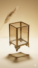 INVOKE decorative glass makeup brush holder with antique brass frame and ornate feet. Clear glass with vintage detailing.