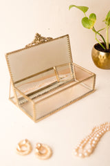 INVOKE decorative glass jewelry box with antique brass finish, hinged lid, and interior divider. Holds pearl necklace.