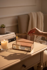 INVOKE decorative glass jewelry box with antique brass finish, holding necklaces and bracelets.