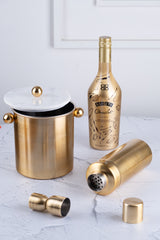 INVOKE luxury brushed gold cocktail shaker, ice bucket with marble lid, and jigger. Perfect for home bars.
