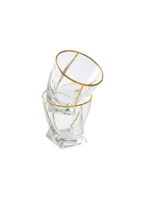 INVOKE Savoy Whiskey Glasses with gold rim, angular design, and sturdy base. Includes gold jigger and silver tongs.