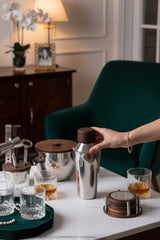 INVOKE Stainless Steel Barware Set with wooden accents, including cocktail shaker, ice bucket, jigger, bottle opener, and coasters.